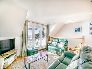 Living area - A contemporary house in a peaceful setting, with superb views over the sea. (Seaton)