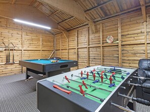 A room with a pool table, a foosball table, and a billiards rack. - 2 bedroom accommodation in Harwood Dale, near Scarborough (Harwood Dale, near Scarborough)