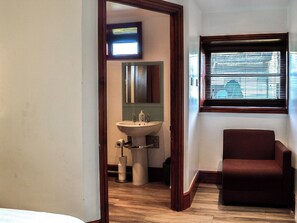 A bathroom with a sink, mirror, and window. - Ochiltree Cottage - UK7781 (Newton Stewart)