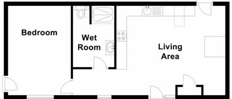 A floor plan with a bedroom, wet room, and living area.