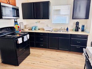 Fridge, microwave, stovetop, coffee/tea maker