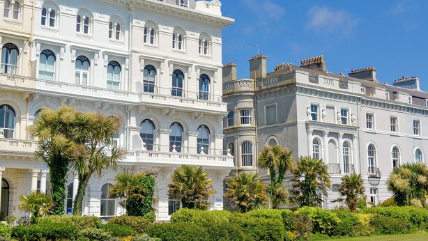 A multi-story building with classic architecture, featuring arched windows and a symmetrical facade. - Mayflower Apartment-UKC93 (Plymouth)