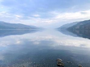 A calm lake with clear water, surrounded by mountains. - Abbey Church 20 - UKC4881 (Fort Augustus)