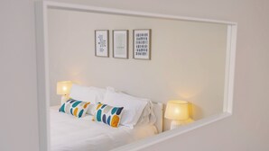 A hotel room with a bed, two bedside lamps, and three framed artworks on the wall. - Number Four - UKC4966 (Tawstock, near Barnstaple)