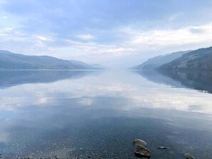 A calm lake with clear water, surrounded by mountains. - Abbey Church 14 - UKC5423 (Fort Augustus)