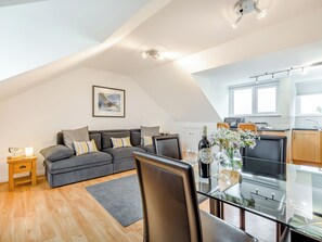A modern loft apartment with a dining area, kitchen, and living space. - 1 bedroom accommodation in St Minver, near Rock (St Minver, near Rock)