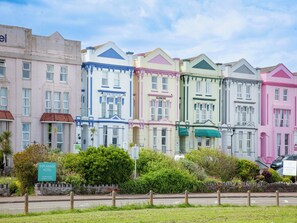 A row of colorful, historic buildings with signage for 'Sunnybeach' and 'Glencoe'. - Mermaids View - UKC6166 (Paignton)