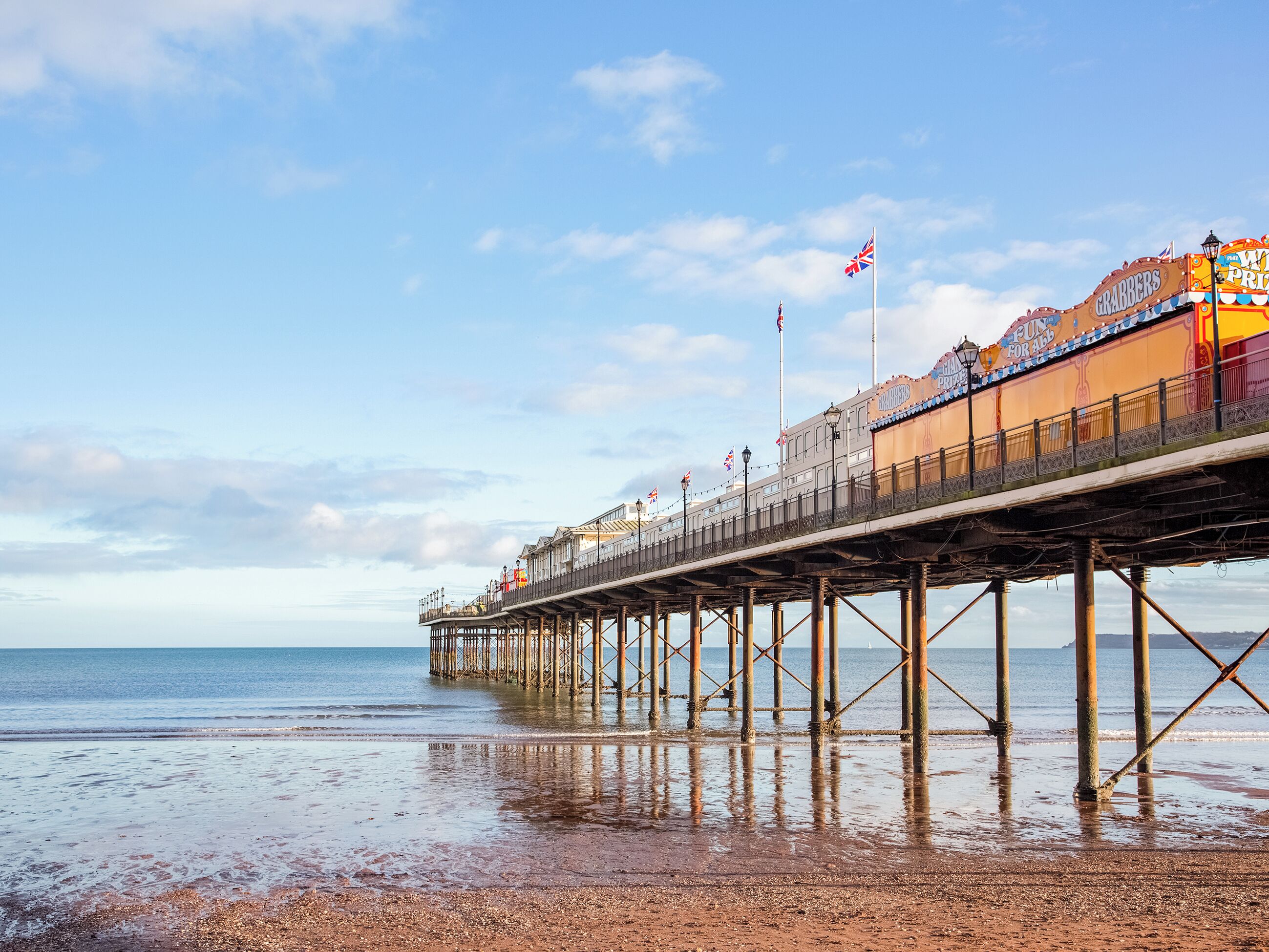 A pier extending into the sea with a building labeled "Grabbers" on the right.