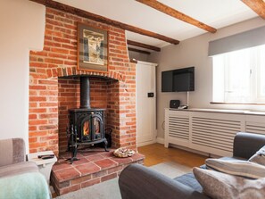TV, fireplace - A lovely little cottage sitting pretty in the sought-after Burnhams. (Burnham Thorpe)