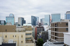 A cityscape with modern high-rise buildings and a mix of architectural styles. - AKA Hotel (Tokyo)