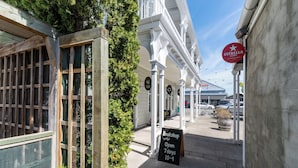 A building with a sign for 'Bookshop Open 7 days 10-4'. - Altitude Studio, one bedrooms studio in the heart of Martinborough (Martinborough)
