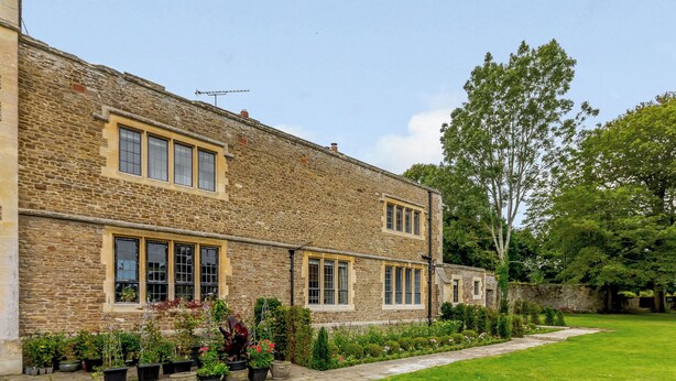 A stone building with multiple windows and a well-maintained lawn. - Heron's Wood at Greyfriars - UK33357 (Winchelsea)