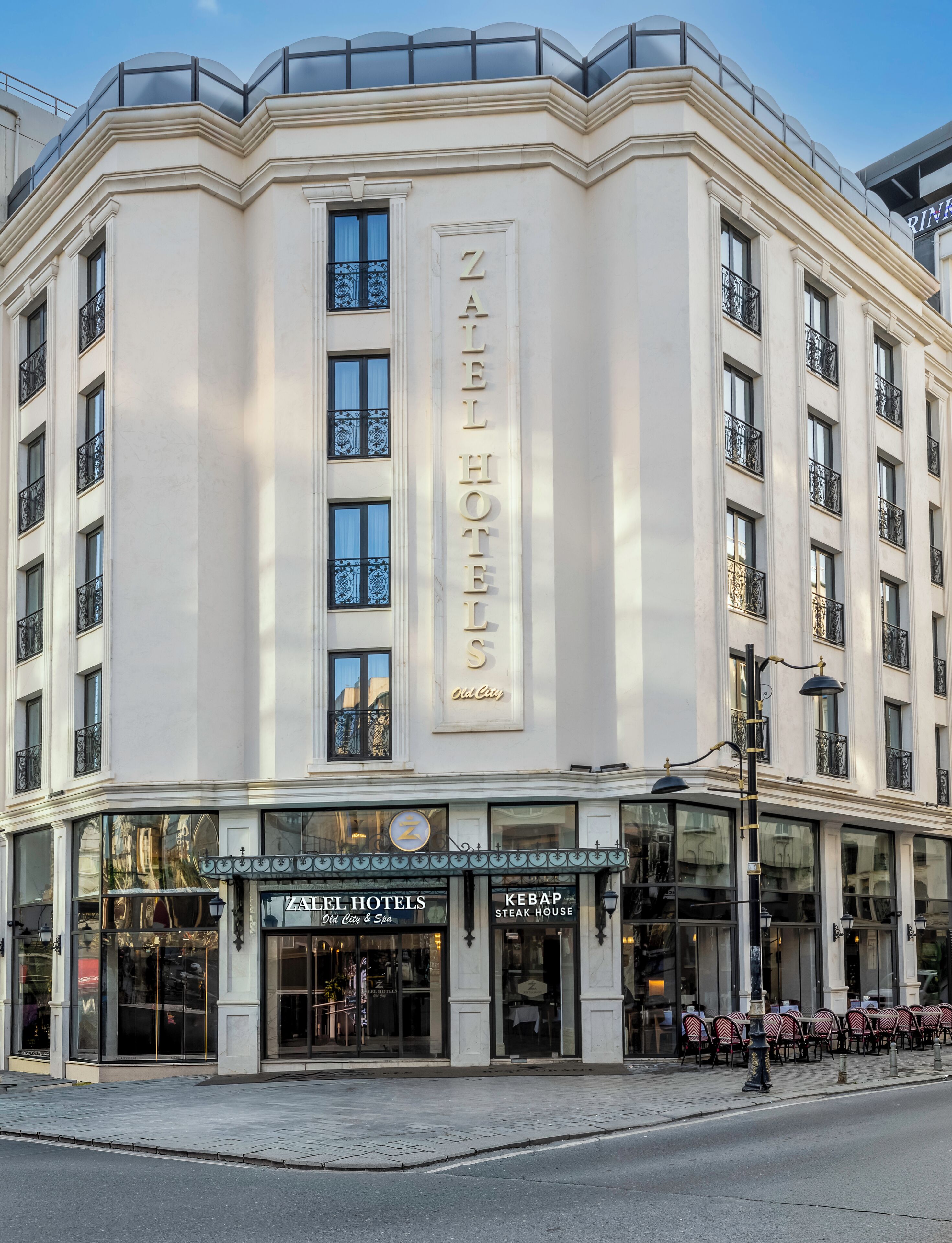 A hotel with a prominent sign reading 'ZELL HOTEL Old City.'