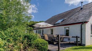 A building with a sloped roof, a chimney, and a small window. - The Coach House - UK35246 (Llanfyrnach)