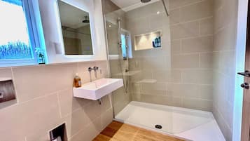 Shower, hair dryer, towels, soap