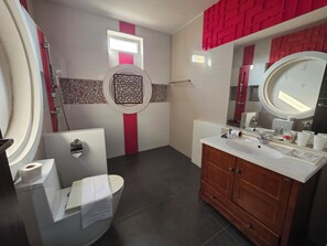 A bathroom with a toilet, bidet, vanity with a mirror, and a shower area. - O-Haus Chiangmai Airbnb Host (Hang Dong)