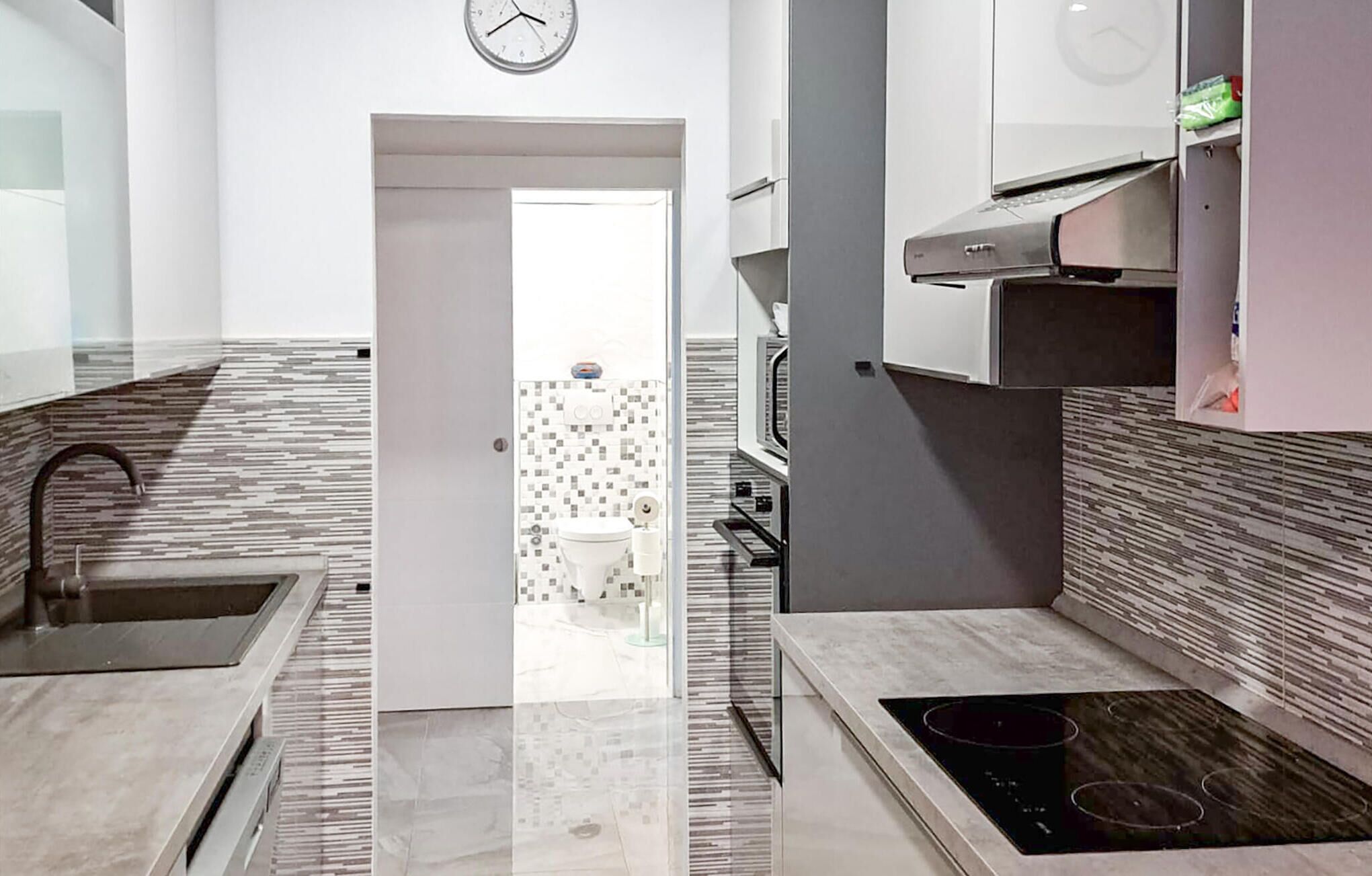 Fridge, stovetop, dishwasher, coffee/tea maker