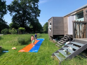 Children’s area - Circus wagon on wheels, Tinyhouse, Tinyhaus, on a green field, near Hamburg (Hammah)