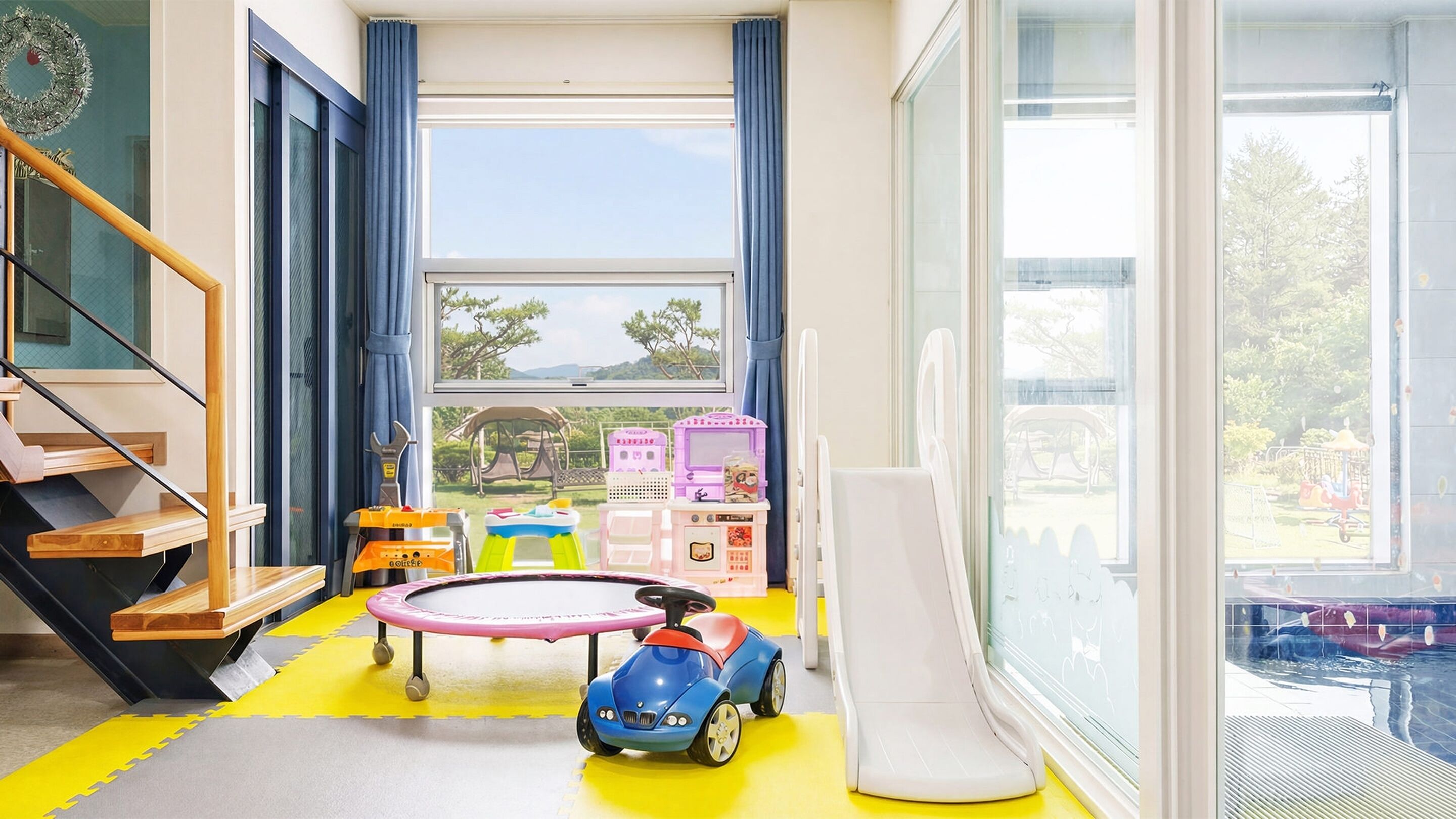 A room with a large window, a play area with toys, and a staircase.
