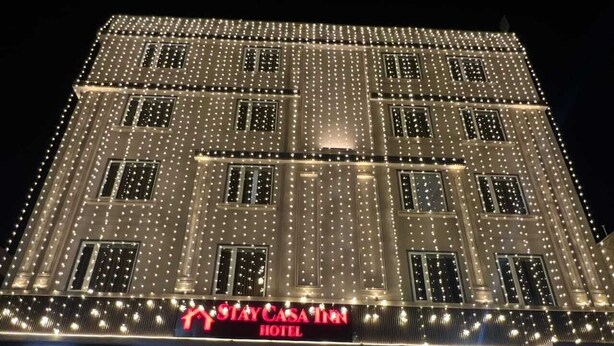 A hotel facade with a sign reading "STAYCASA HOTEL" and a ground-level entrance. - Stay Casa Inn (Jaipur)