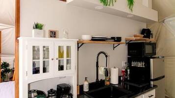 Coffee/tea maker, fridge, stovetop, cookware/dishes/utensils