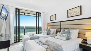 A hotel room with two beds, a TV, and a large window with a view of the ocean. - Soul Surfers Paradise - Lvl11 Ocean View - Apartment (Surfers Paradise)