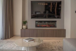 TV, fireplace, offices - Modern Serenity | Jacuzzi, Sauna & Valletta Views (Sliema)