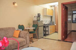 Deluxe Apartment, Balcony, City View | Living area - Cobot Suites Marcus Garden (Nairobi)