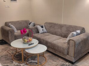 Deluxe Apartment, Balcony, City View | Living area - Cobot Suites Marcus Garden (Nairobi)