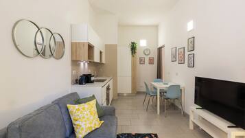 Standard Apartment, Balcony | Living area | 43-inch Smart TV with digital channels