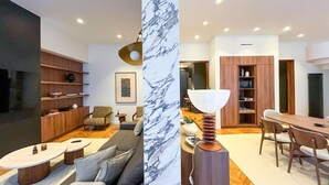 Una sala de estar moderna con un sofá, una mesa de centro y un comedor con una mesa y sillas.