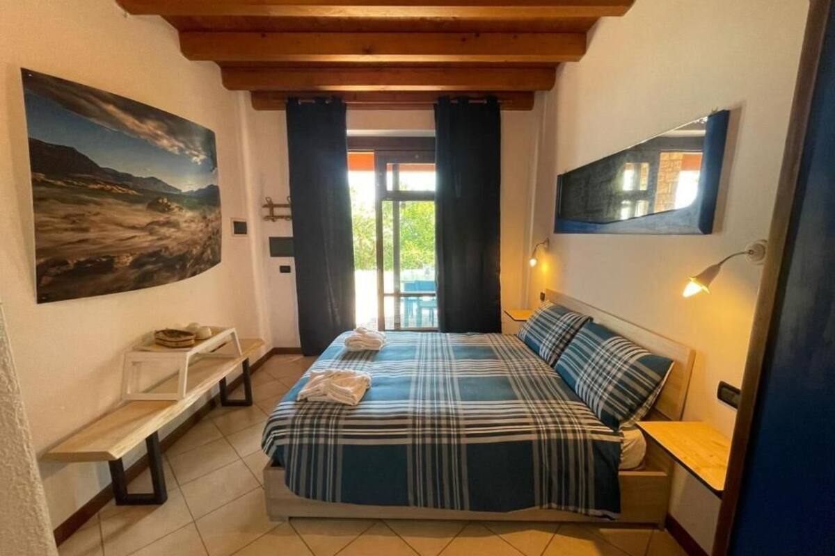 Family Studio, Patio, Partial Lake View | Blackout drapes