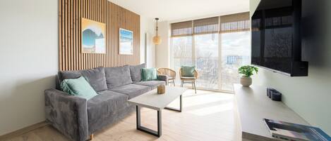 Apartment (54) | Living area | Flat-screen TV