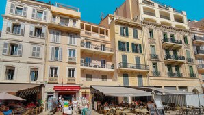 A multi-story building with balconies and outdoor seating areas. - Duplex 2 bedrooms Terrace Sea view A2B024 (Cannes)