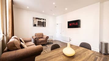 Deluxe Apartment, 1 Bedroom, Ground Floor | Living area | TV