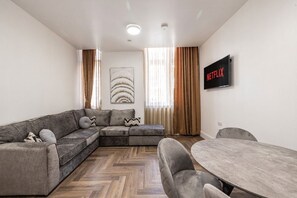 Deluxe Apartment, 2 Bedrooms, Ground Floor | Living area | TV
