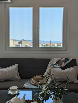 อพาร์ทเมนท์สำหรับครอบครัว, ระเบียง, วิวทะเล | บริเวณนั่งเล่น | เครื่องพิมพ์