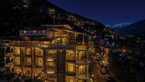 A multi-story building with a sign reading 'FLAMINGO RESORT.' - Flamingo Resort (Manali)