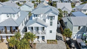 A residential area with multiple two-story houses, each featuring a balcony and a garage. - 7BR Heart of Home W Pool Near the Beach (Miramar Beach)