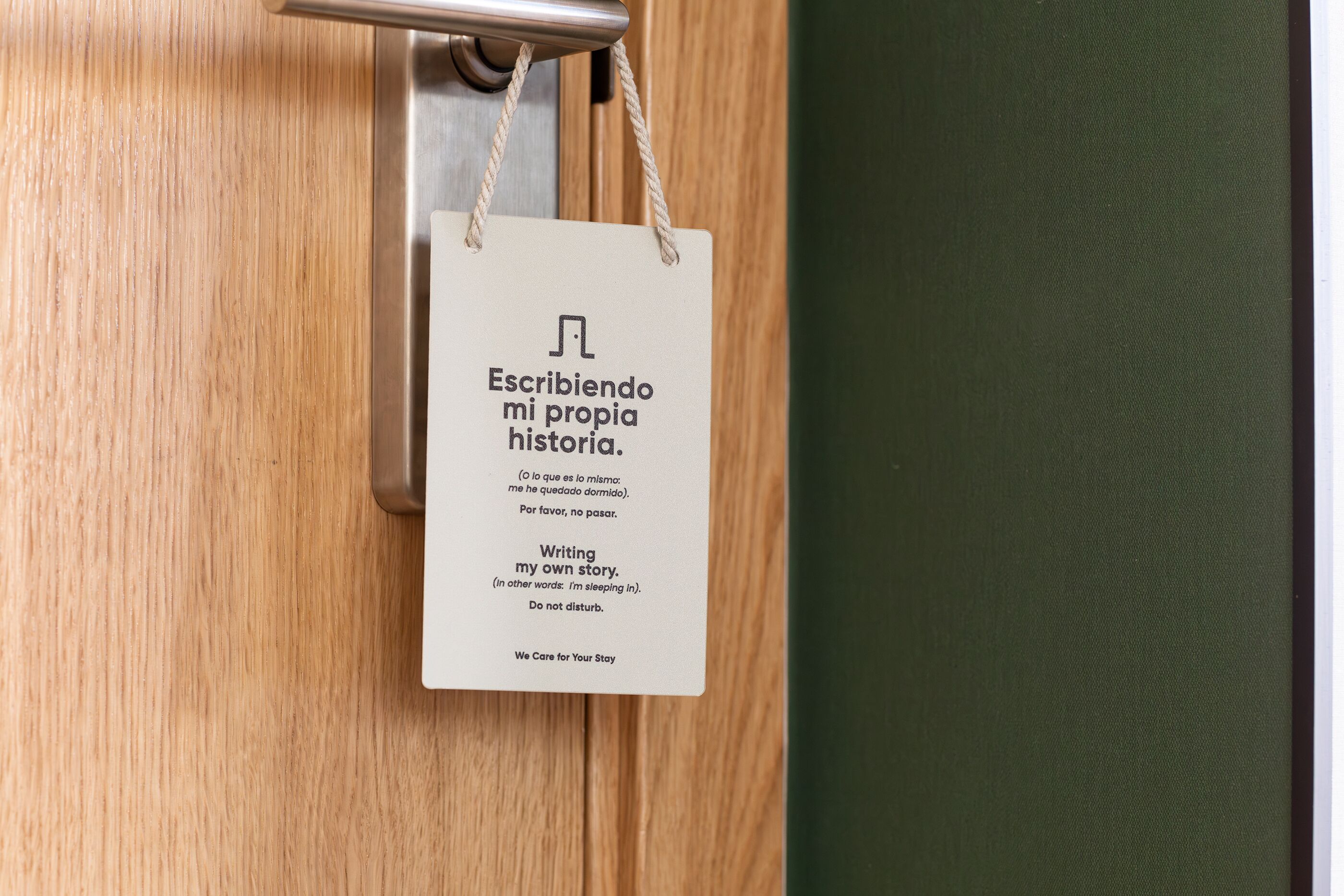 A wooden door with a sign hanging on it.