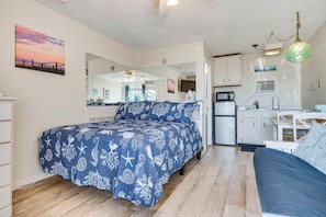 A bedroom with a bed, a sofa, a kitchen area, and a bathroom. - Steps to Sandy Beach! Oceanfront Old Orchard Gem (Old Orchard Beach)