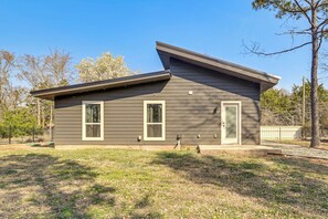 A two-story house with a sloped roof, two windows, and a door. - Bring Your Boat! Family Haven 2 Mi to Lake Texoma (Pottsboro)