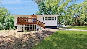 A single-story house with a wooden deck and a fenced backyard. - On-site Trails! 'serenity Acres Retreat' in Macon (Macon)