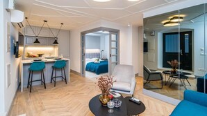 A modern hotel room with a kitchen area, a dining space, and a bedroom. - THE OLD WELL ELEGANCE by DuHomes  (Dubrovnik)