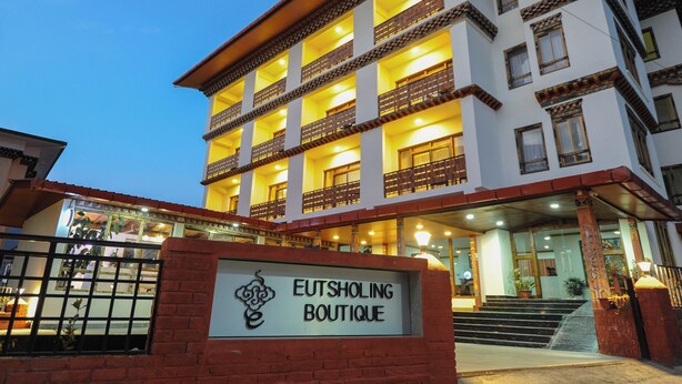 A multi-story building with a sign reading "EUTSHOLING BOUTIQUE". - Eutsholing Boutique Hotel (Thimphu)
