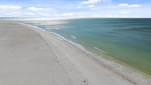 A beach with a clear sky and calm sea. - Sunset Views at EB & Tennis Club 104C (Fort Myers Beach)