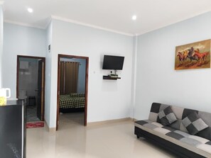 Habitación doble, balcón | Zona de estar