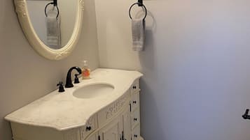 Shower, towels, soap, toilet paper
