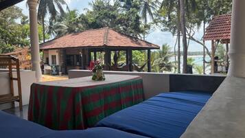 Standard Triple Room, Balcony, Beach View | Terrace/patio