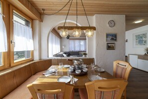 Bright dining area with large dining table and corner bench - Chalet Stadel – Holiday Home with Fireplace (Unterwasser)
